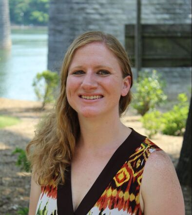 Photograph of Author Rachel W Hague standing in front of the Tennessee River